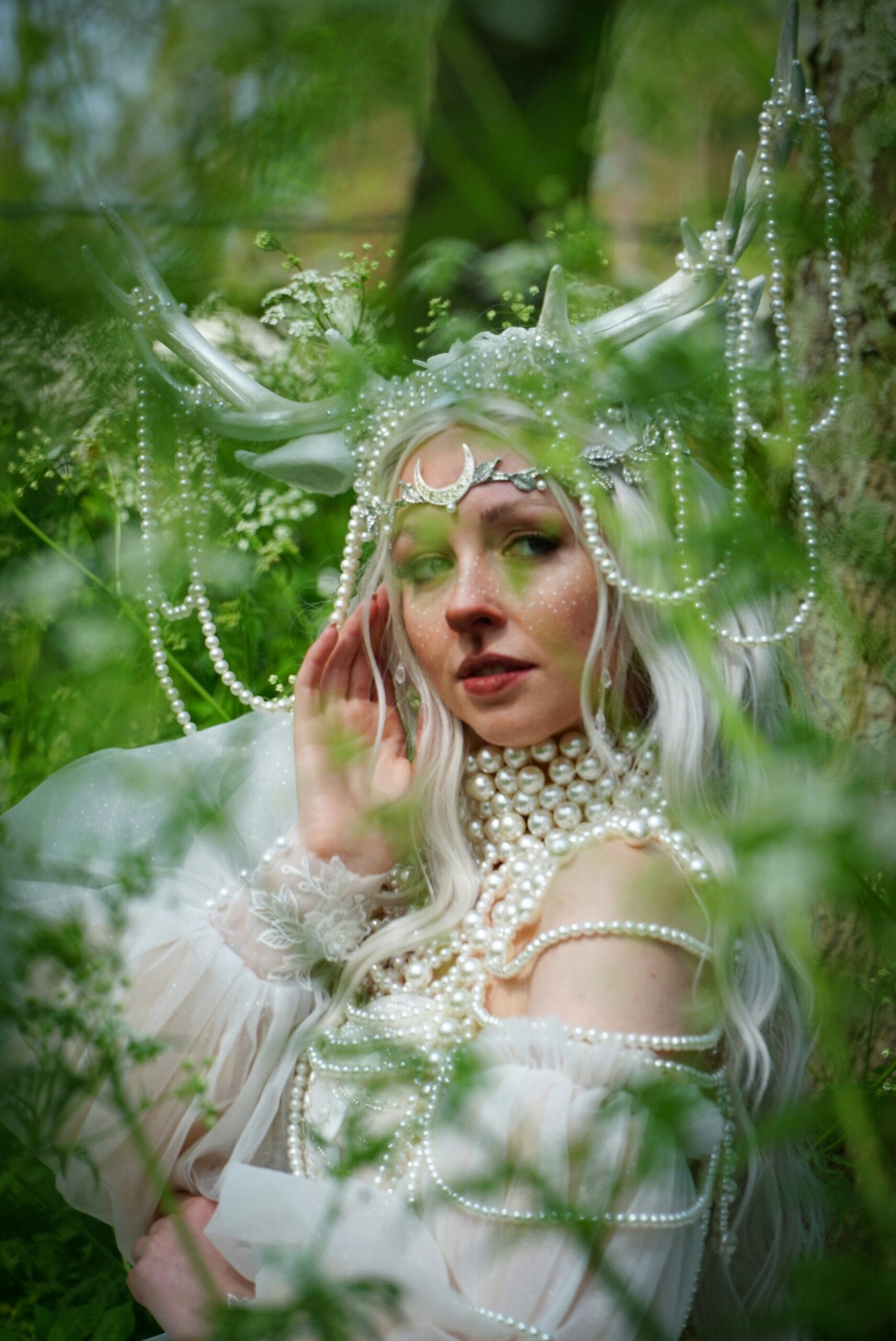 a woman with white hair wearing a costume